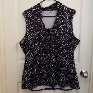 Navy poka dot sleeveless top.